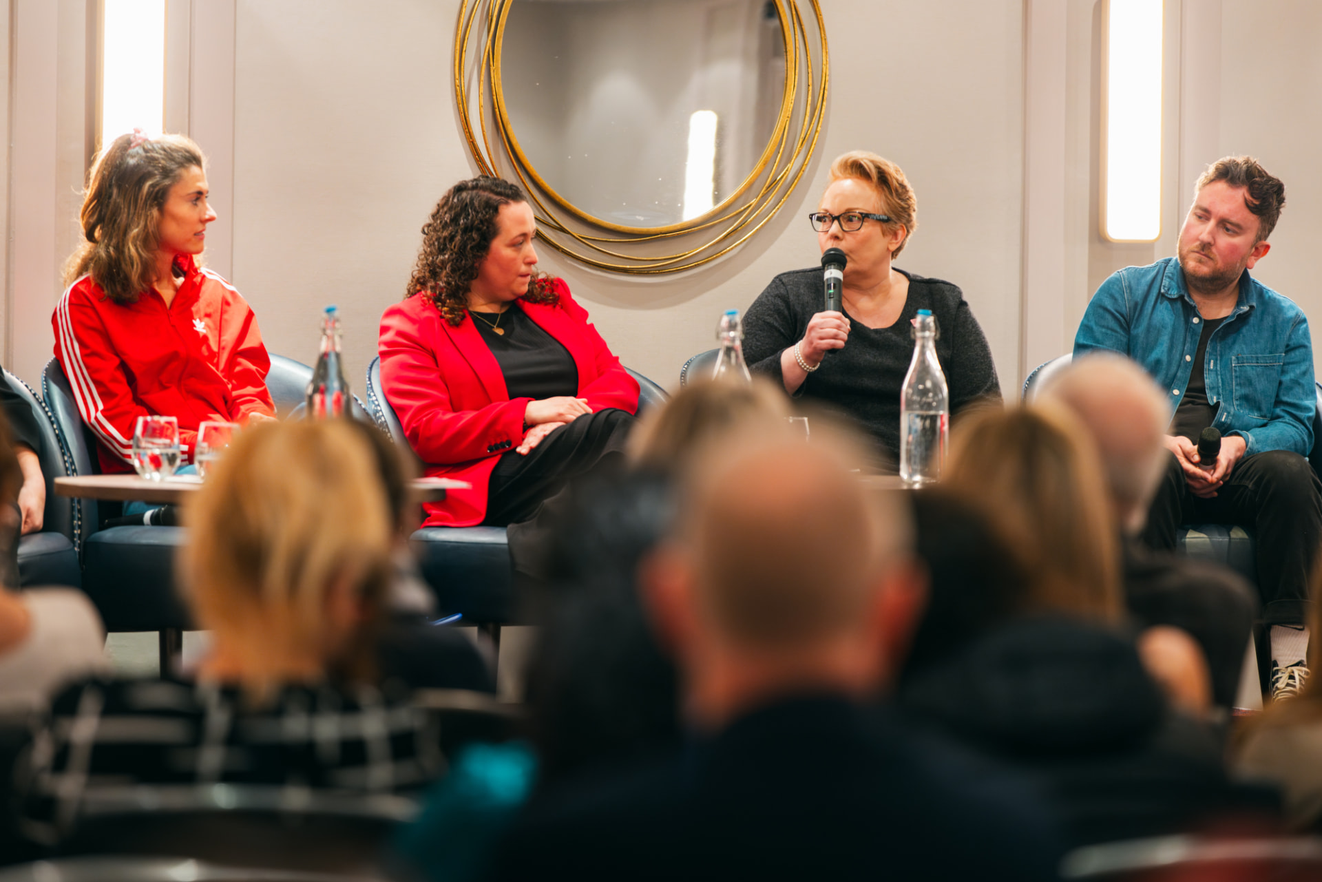 A panel of founders and business leaders speaking to a Startup Disruptors audience